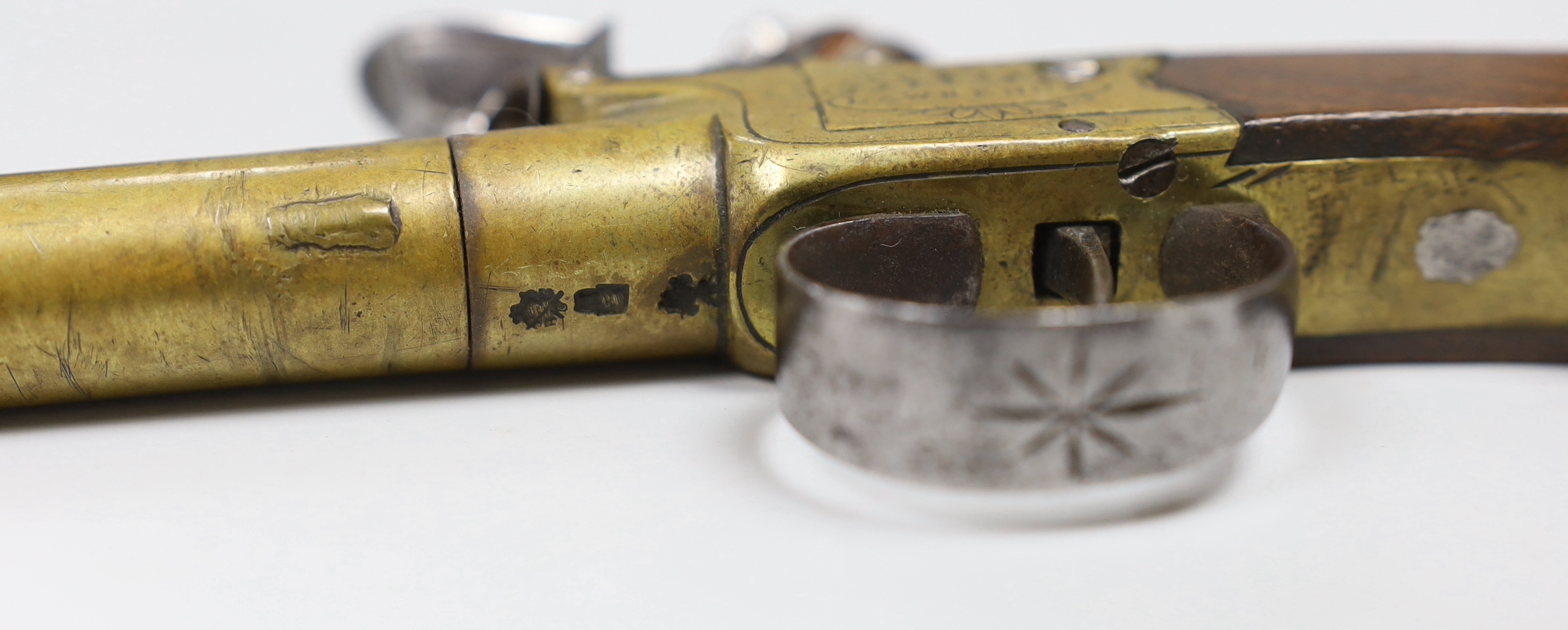 A George III flintlock pocket pistol, with turn off brass barrel, signed ‘Lawrence’